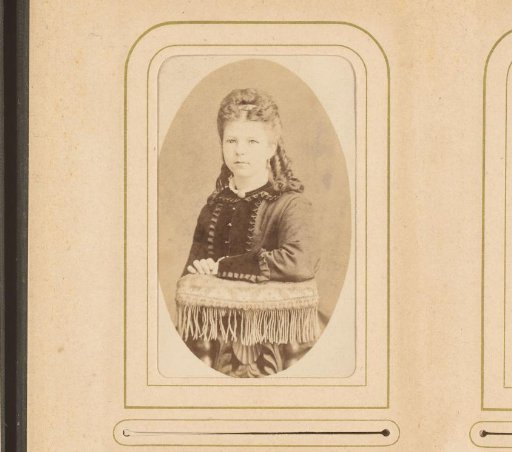 Portrait of a seated woman, leaning on the back of a chair