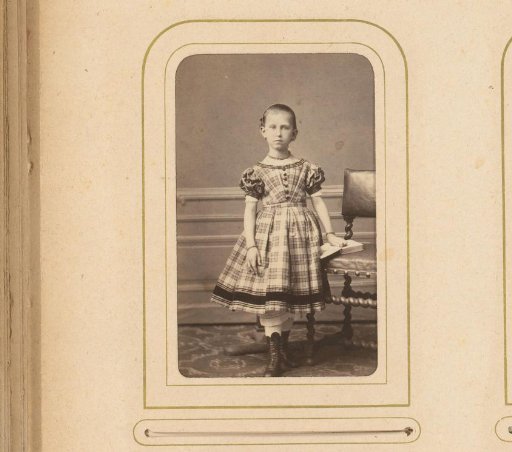 Portrait of a Girl Standing by a Chair with Her Hand on an Open Book