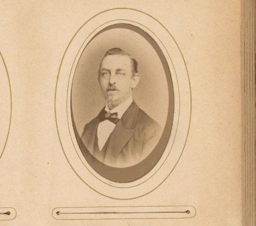 Portrait of a man with a moustache, beard, and bow tie