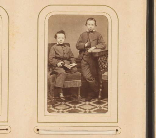 Portrait of a seated boy and a standing boy