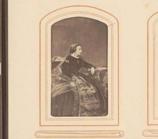 Portrait of a seated woman with a veil