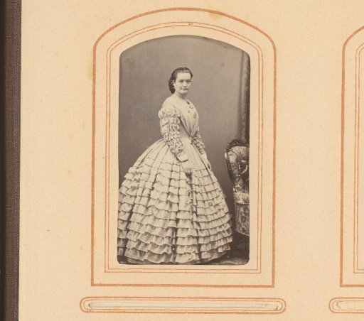 Charlotte Strandberg, standing in a striped jacket