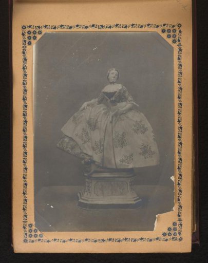 Porcelain sculpture of a woman in a dress