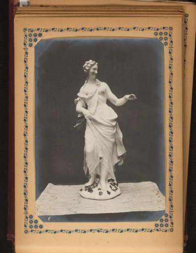 Sculpture of a standing woman with a bare breast