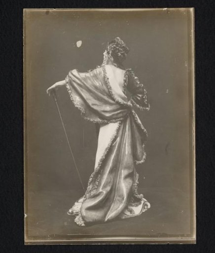 Porcelain sculpture of a bearded man in a floral robe