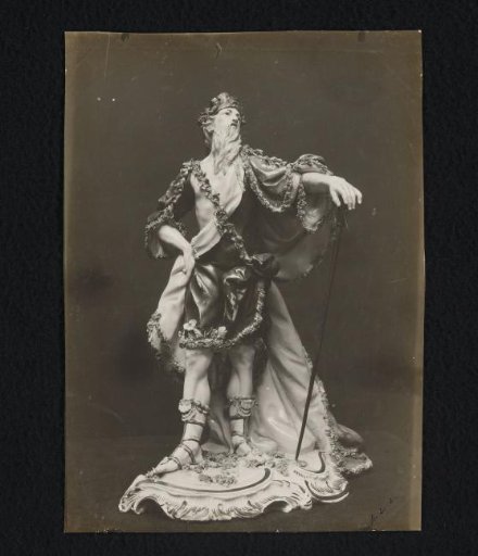 Porcelain sculpture of a bearded man in a floral robe
