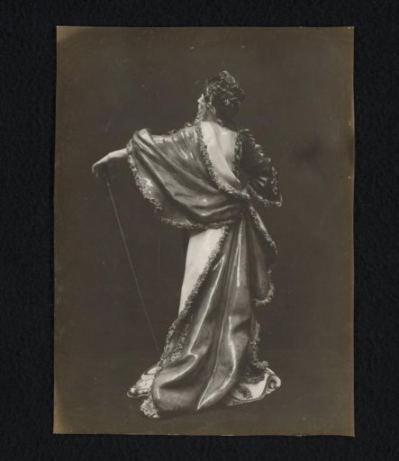 Porcelain sculpture of a bearded man in a floral robe
