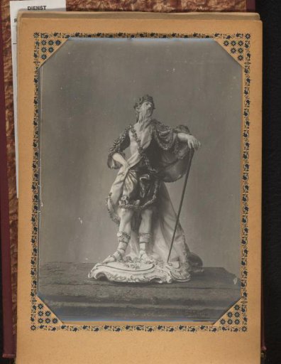 Porcelain sculpture of a bearded man in a floral robe