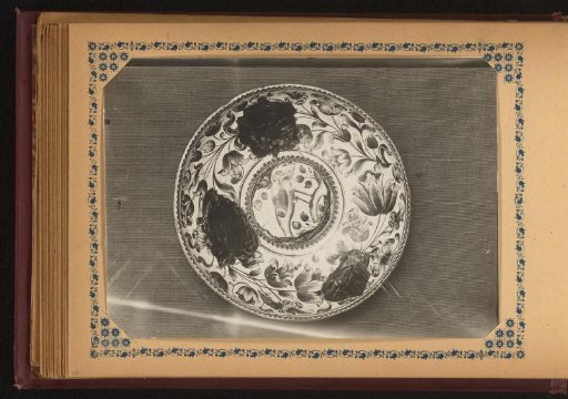 Plate painted with flowers and birds