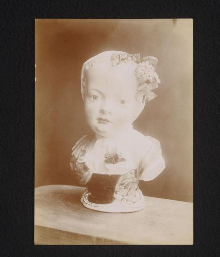 Porcelain bust of a girl wearing a cap