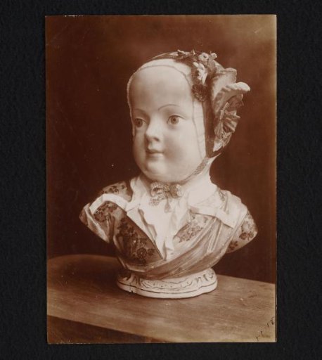 Porcelain bust of a girl wearing a cap