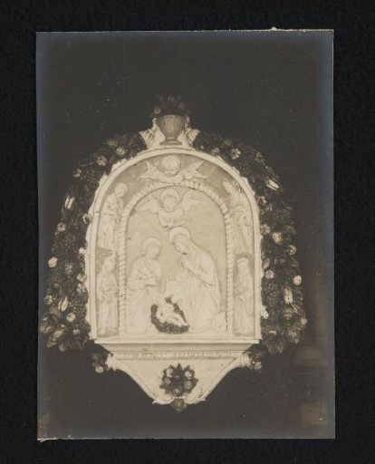 Relief with the birth of Christ in a garland