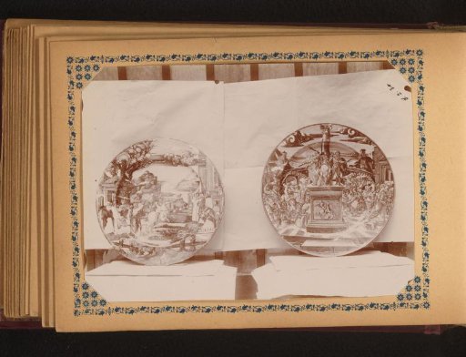 Two plates painted with scenes