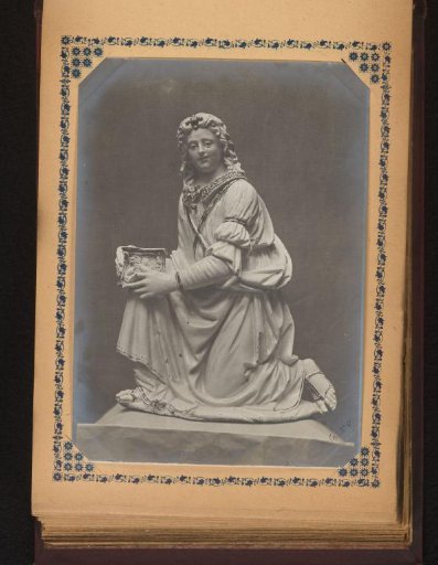Sculpture of a kneeling man
