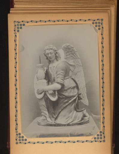 Sculpture of a kneeling angel with a candlestick