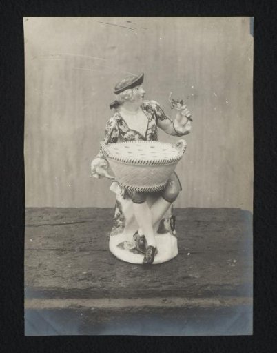 Pepper or salt cellar decorated with a man holding flowers