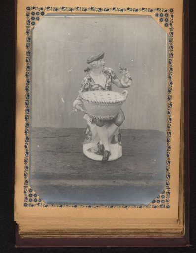 Pepper or salt cellar decorated with a man holding flowers