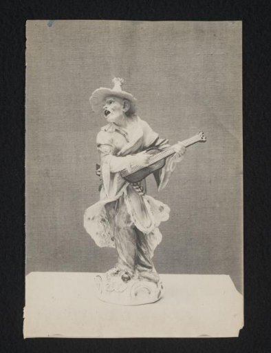 Sculpture of a street musician with a guitar