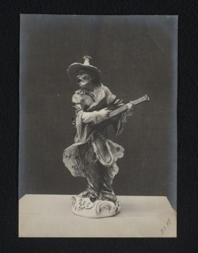 Sculpture of a street musician with a guitar