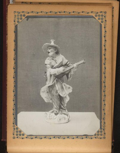 Sculpture of a street musician with a guitar