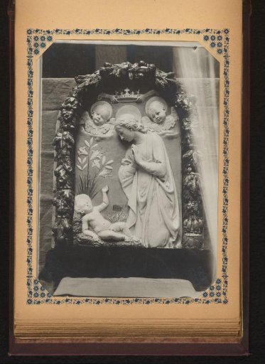 Relief in a garland with the Adoration of Christ