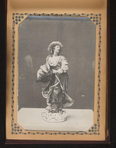 Sculpture of a woman holding an object