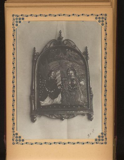 Panel framed in metal with the Annunciation