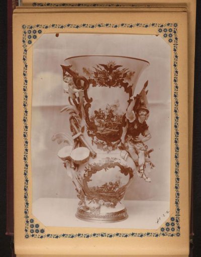 Vase decorated with two depictions of battles, drums, a soldier, and a putto with a symbol of masculinity