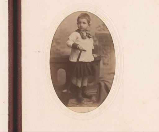 Portrait of a standing boy with shovel