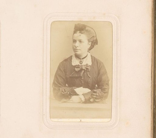 Portrait of a woman with a necklace, leaning on a balustrade