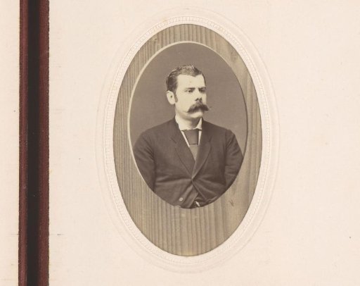 Portrait of a man with moustache, wooden background