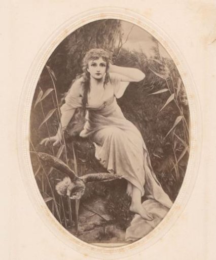 Photographic reproduction of a painting of a seated woman in a landscape with a flying owl