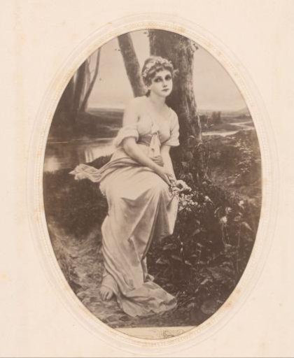 Photographic reproduction of a painting of a woman with flowers in her hair, seated by the water