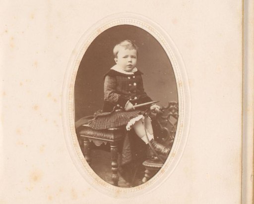 Portrait of a boy with hoop in hand, seated on a stool, inscribed as Jules