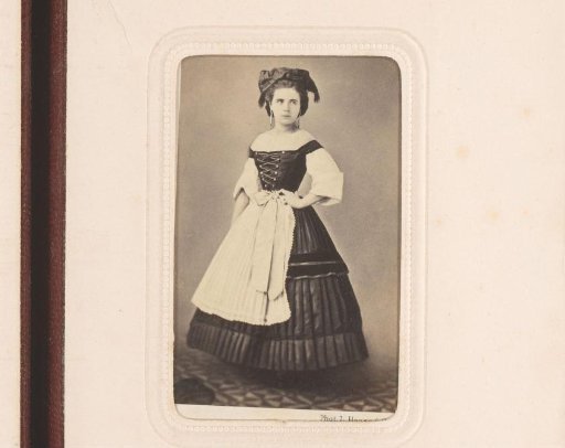 Portrait of a standing young woman in German costume
