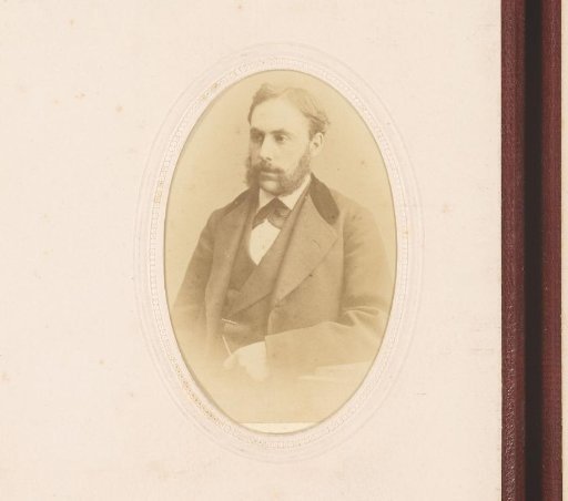 Portrait of a seated man with sideburns