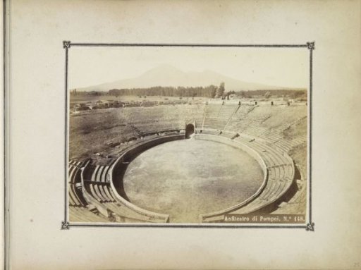 Interior of the amphitheater in Pompeii with Vesuvius in the background
