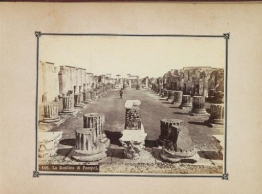 Ruins of the Temple of Venus in Pompeii with Vesuvius in the background