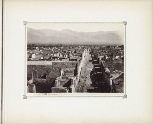 View of the ruins of Pompeii with mountains in the background