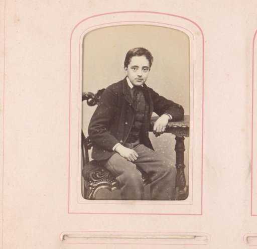 Portrait of a boy sitting at a table