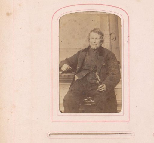 Portrait of a seated man in a greatcoat