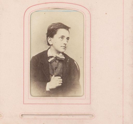 Portrait of a boy with his thumb hooked in his waistcoat