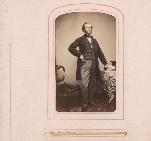 Portrait of Bastiaan de Greef standing by a table