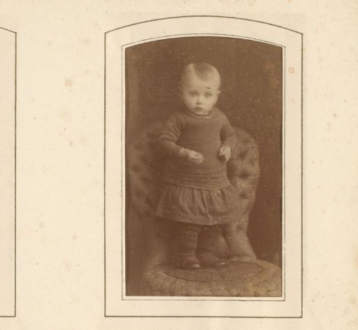 Portrait of a girl, standing on a chair