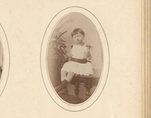 Portrait of a girl sitting on a table