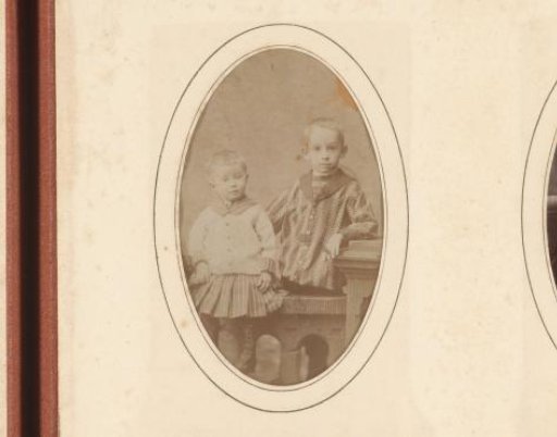Portrait of two children at a balustrade