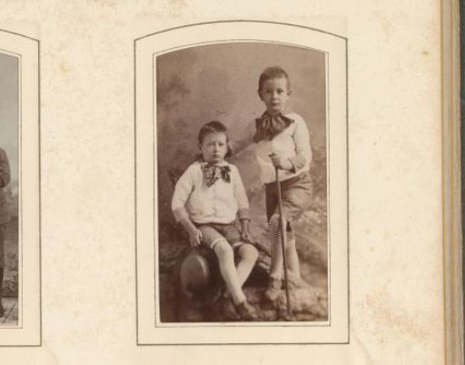 Portrait of two boys with bows