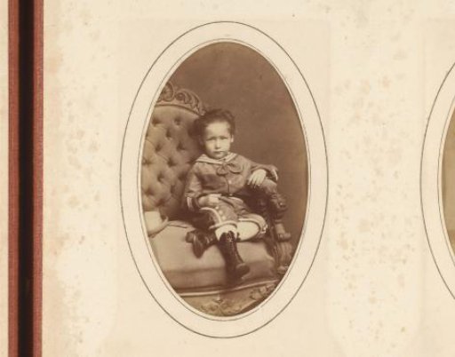 Portrait of a seated boy in a sailor suit
