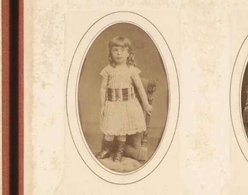 Portrait of a girl standing on a chair