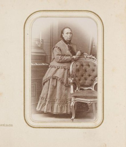Portrait of a woman at a piano
